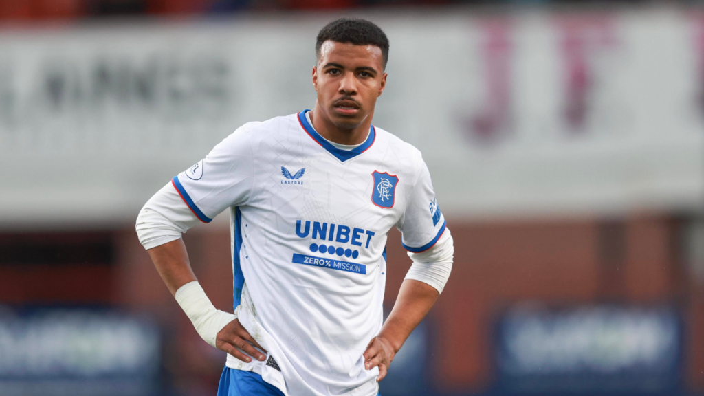 Rangers star Hamza Igamane stands with his hands on his hips.