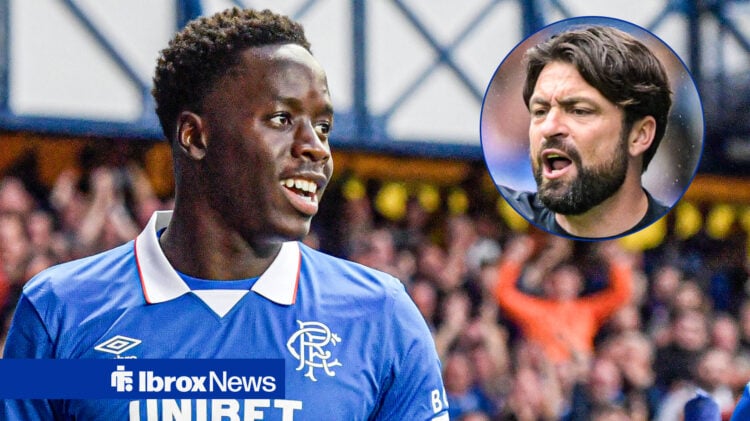 Djeidi Gassama smiles with Rangers manager Russell Martin.