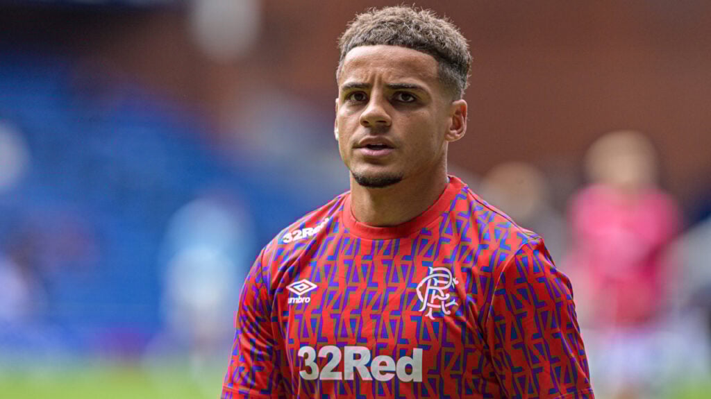 Rangers defender Max Aarons warming up.