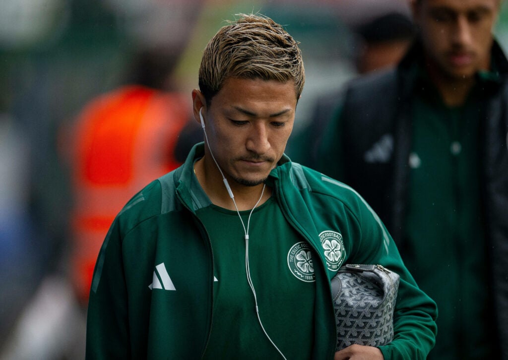 Daizen Maeda walking in a Celtic tracksuit