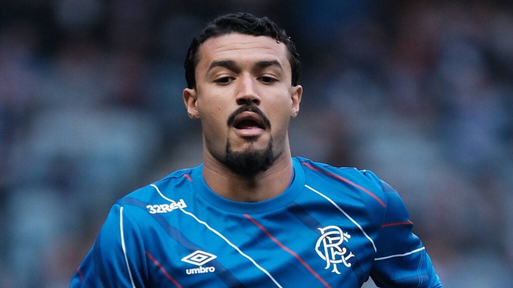 Jefte jogs open-mouthed while playing for Rangers.