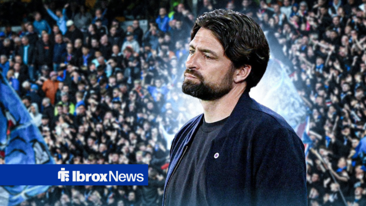 Rangers manager Russell Martin looks bemused as he stares into the distance with Rangers fans in the backround.