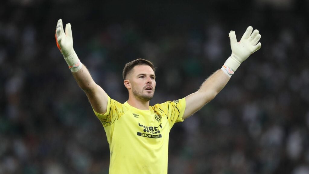 Rangers goalkeeper Jack Butland with his arms in the air