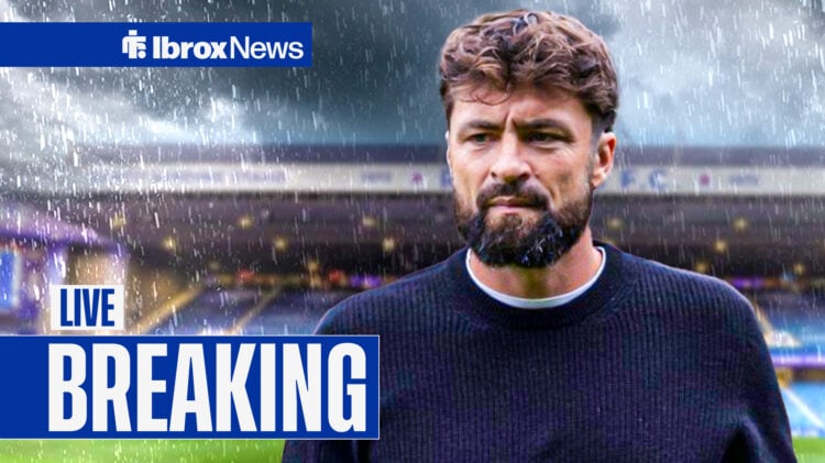 Rangers manager Russell Martin looks sad at a rain-soaked Ibrox.