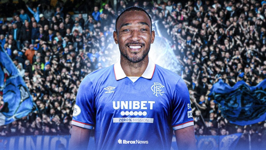 Derek Cornelius smiles in the Rangers 25/26 home kit