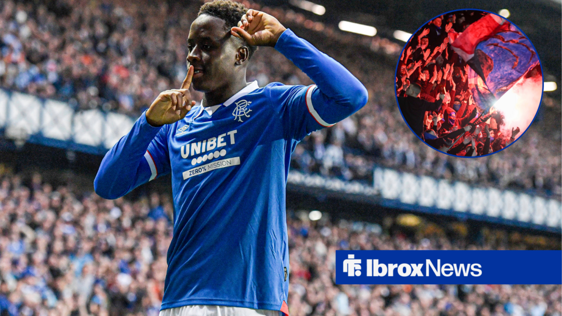 Djeidi Gassama celebrates with rangers fans on right