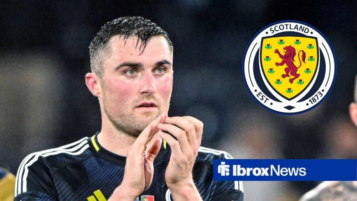 John Souttar in Scotland action, with a Scotland badge in a circular frame