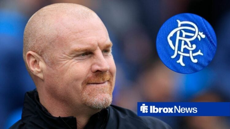 Sean Dyche smiling looking towards the Rangers badge in a circle inset