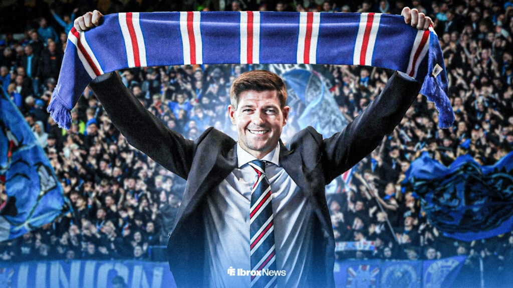 Steven Gerrard holds a Rangers scarf above his head