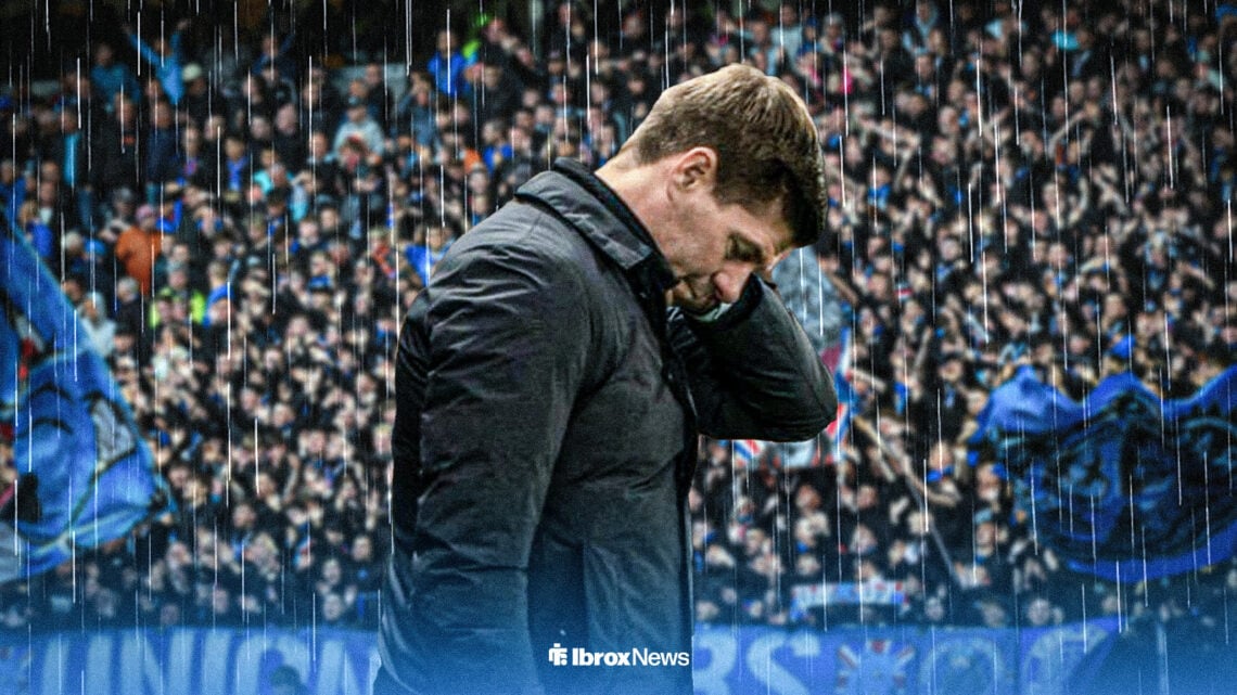 Steven Gerrard looking down in rain with Ibrox in background