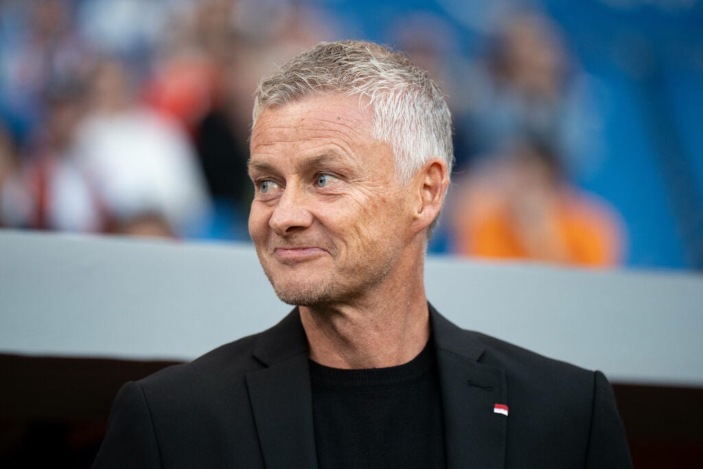 Ole Gunnar Solskjaer looking left with smile on his face