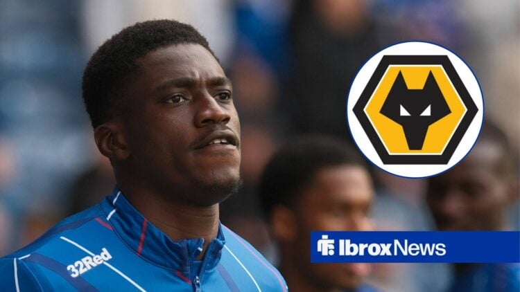 Nasser Djiga looking at Wolves badge.