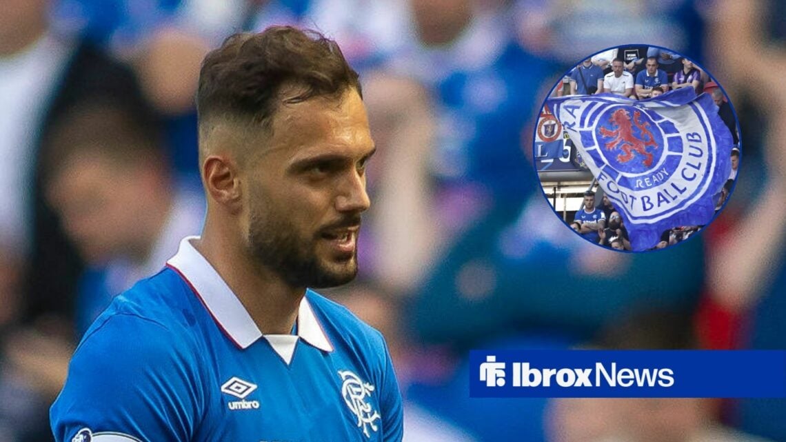 Nedim Bajrami looking at Rangers banner in circle