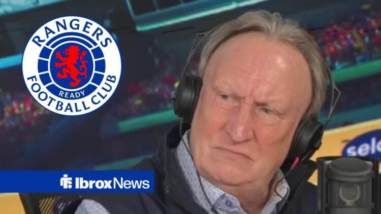 Neil Warnock looking angry in the direction of the Rangers badge.
