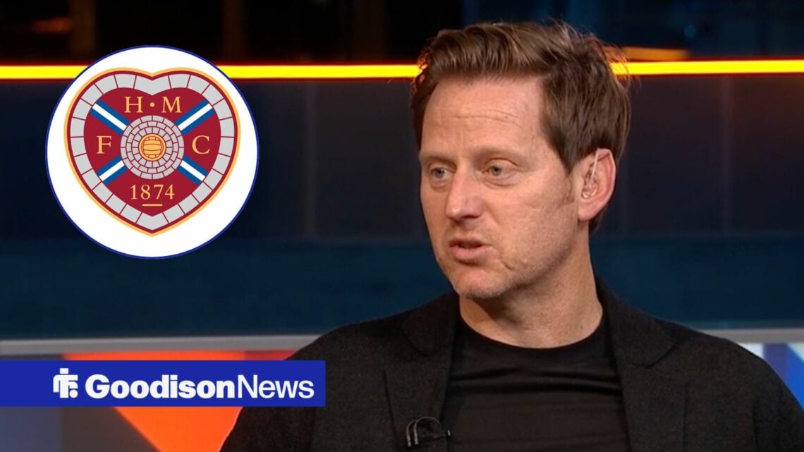 Michael Stewarts looks towards a Hearts badge