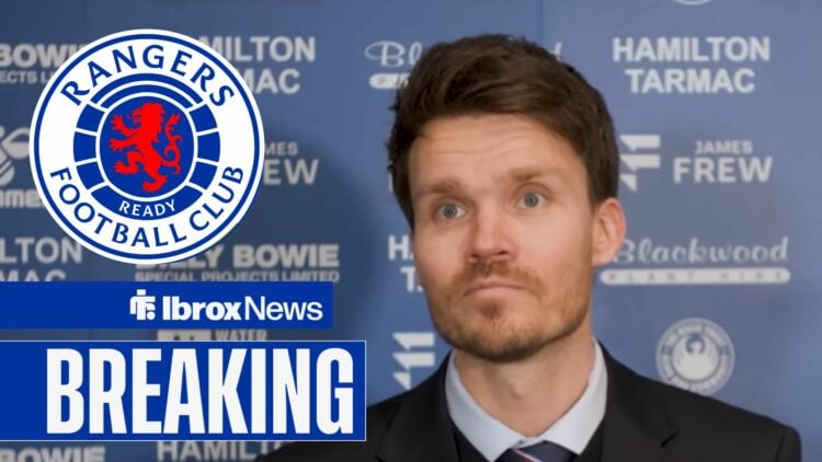 Danny Rohl speaking at a Rangers press conference, with a Rangers badge next to him
