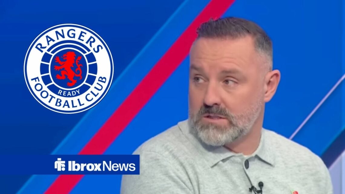 Kris Boyd looks towards the Rangers badge