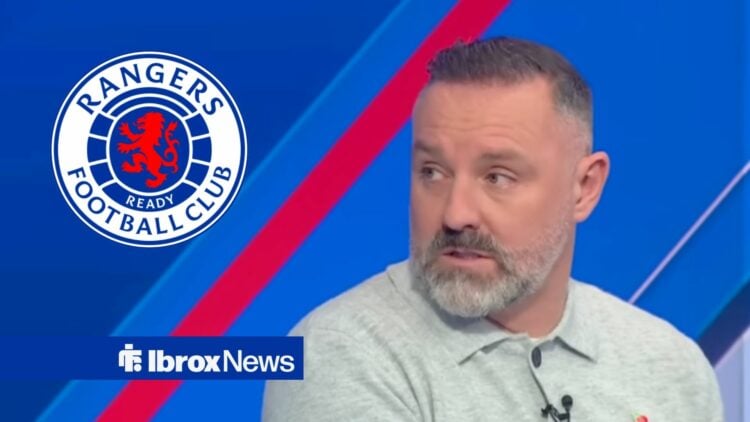 Kris Boyd looks towards the Rangers badge