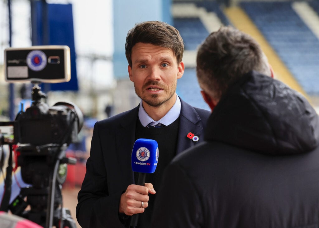 Danny Rohl holding a Rangers TV microphone