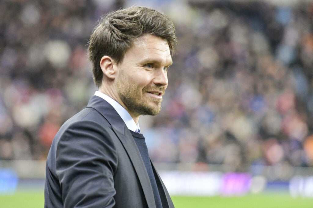 Danny Rohl smiling in a suit