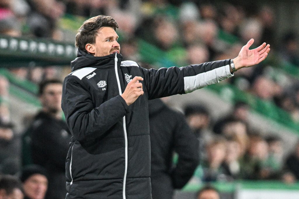 Danny Rohl biting his jacket