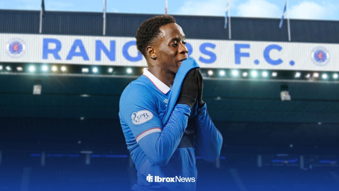 Djeidi Gassama in front of the Ibrox Stadium looking sad.