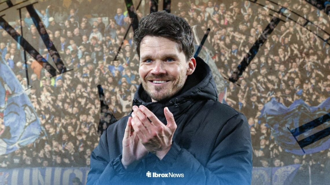 Danny Rohl clapping infront of a clock and Rangers fans