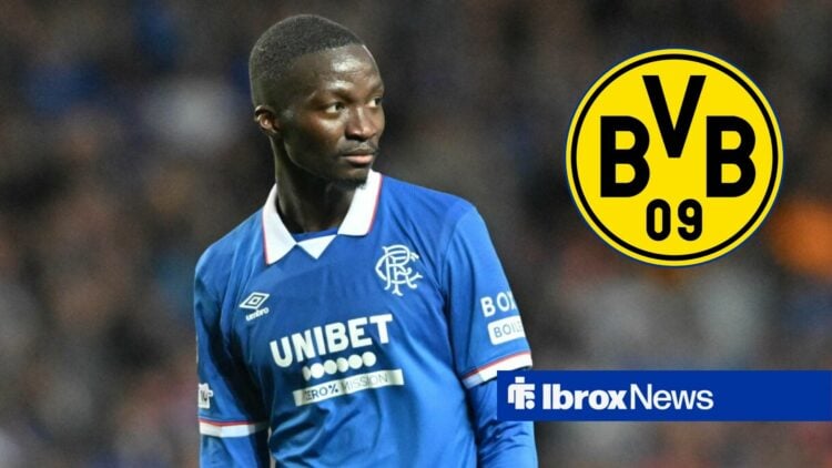 Mohamed Diomande in action for Rangers with Borussia Dortmund badge in circular inset