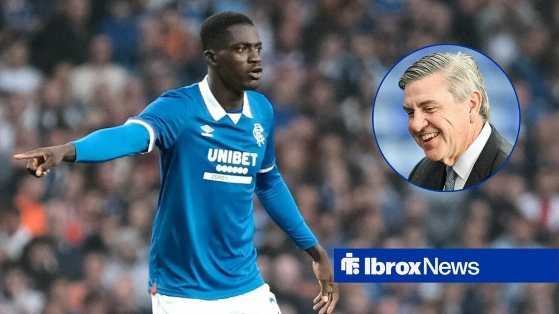 Rangers' Nasser Djiga playing in the Scottish Premiership while Andrew Cavenagh looks at him.