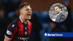 Luke Graham of Dundee celebrates at the end of the match with Kilmarnock, Rangers boss Danny Rohl smiling on the touchline.