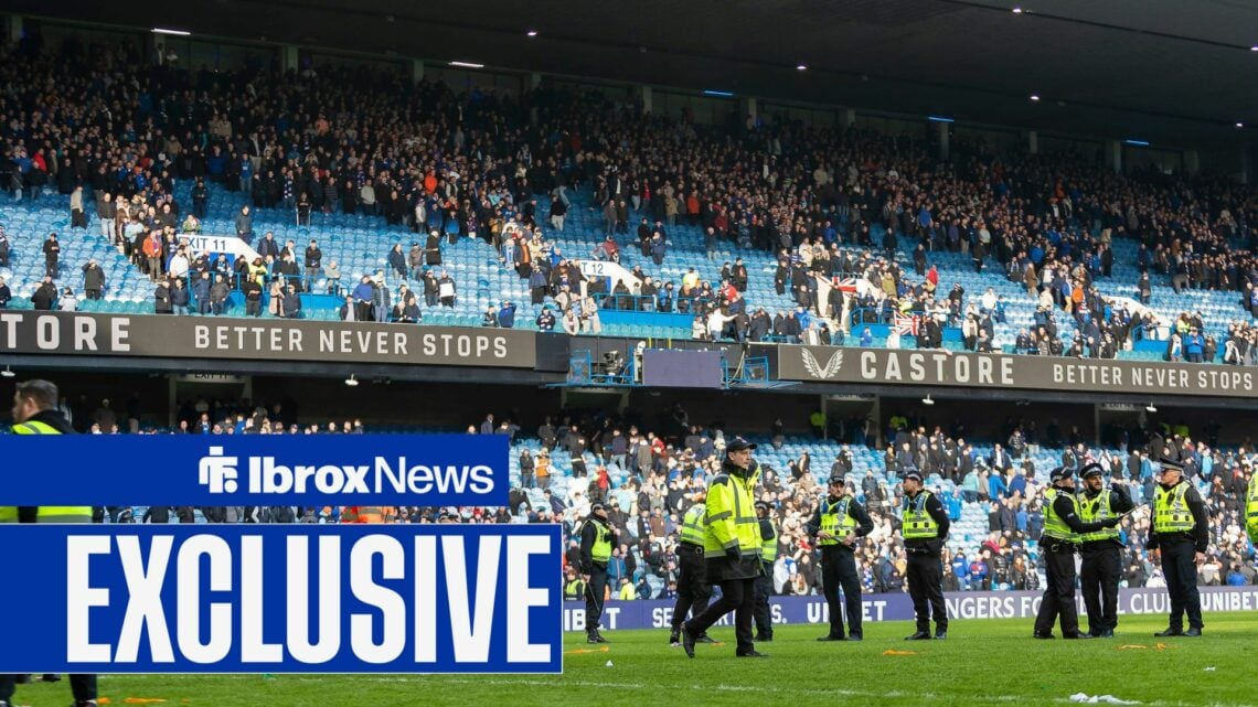 Police and stewards line the pitch as they try to regain order following the crowd trouble after the final whistle during the Scottish Gas Scottish...