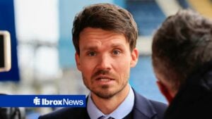 Danny Rohl looks on while talking to Rangers TV