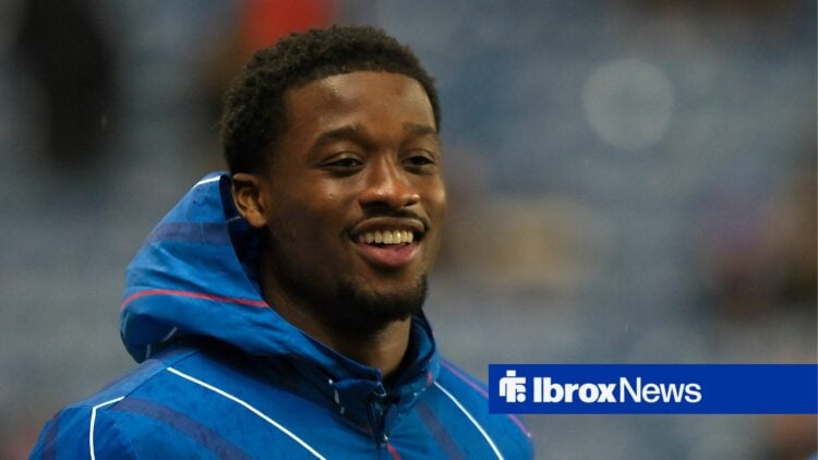 Emmanuel Fernandez smiles whilst warming up for Rangers