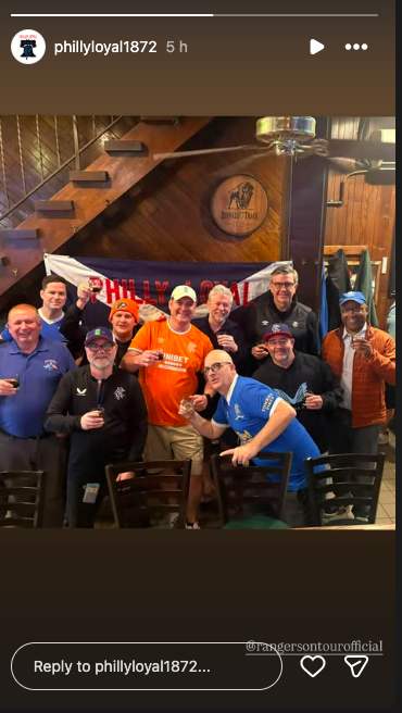 Andrew Cavenagh pictured with Rangers fans in Philadelphia.