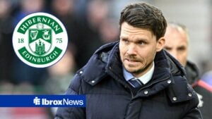 Danny Rohl watches on from the sidelines looking towards a circle inset of the Hibernian badge